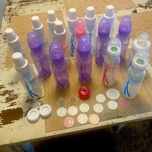 17 bottles, size 1 and 2 nipples, transition nipple, bottle stoppers etc.